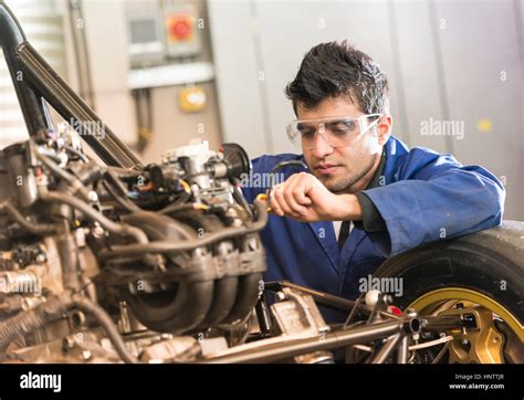 Mechanic Working On A Car Engine Stock Photo Alamy