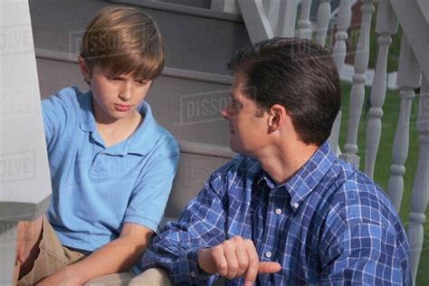 A Father Talking To His Son Stock Photo Dissolve