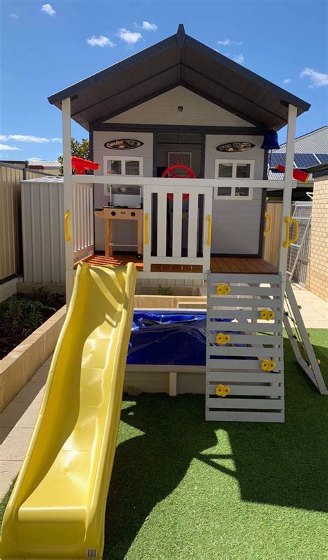 Large Wooden Above Ground Cubby House With Slide And Sandpit Backyard