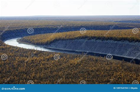 Helicopter View Of The Turn Of The Siberian River Flowing Among The
