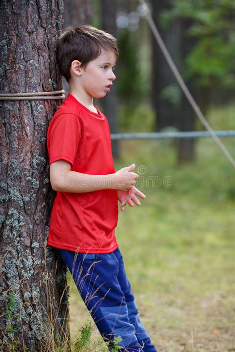 Sad Little Boy Standing Under The Tree Stock Photo Image Of Caucasian