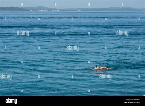 A Woman Swim In The Sea Stock Photo Alamy