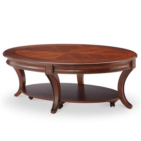 2023 Latest Winslet Cherry Finish Wood Oval Coffee Tables With Casters