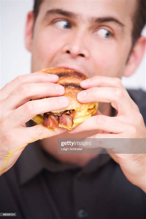Eating Greasy Food High Res Stock Photo Getty Images