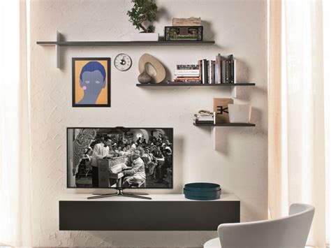 This one has a very simple design, featuring wooden slats attached to steel a common place for the tv is above the fireplace, is the room has one. TV Wall Shelf Wood in Different Styles - http://www ...