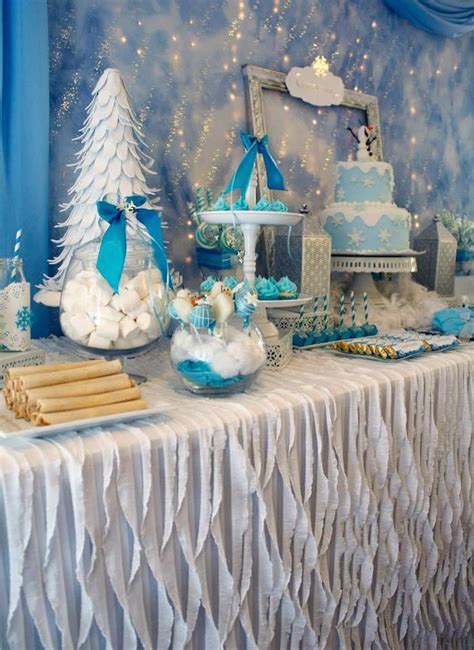 Setting a table for the party guests creates an exciting atmosphere, and gives somewhere for kids to eat and drink together, while safely seated. Kara's Party Ideas Frozen winter wonderland themed ...