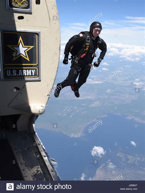 A Us Army Golden Knights Skydive Team Member Jumps From His Plane