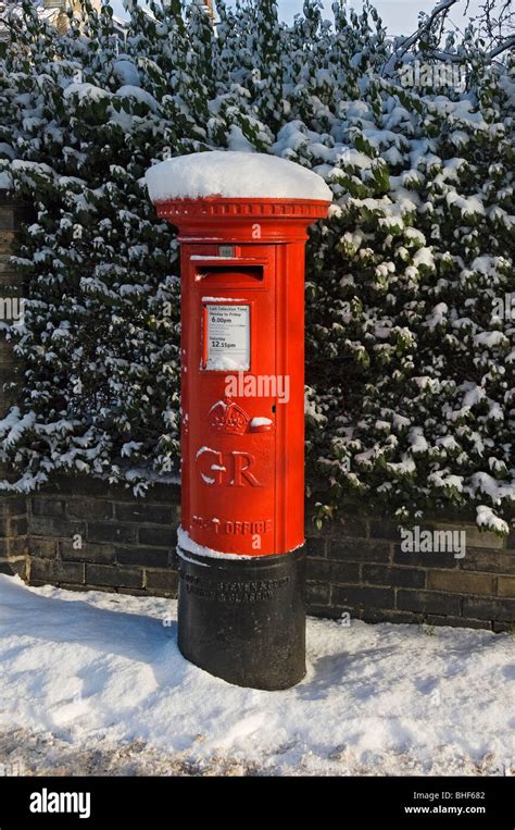 Traditional British Red Postbox Post Box Covered In Snow In Winter York