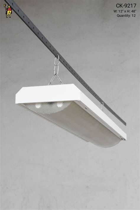 4 Curved Prismatic Lens Fluorescent Fixture Available As Hanging Or