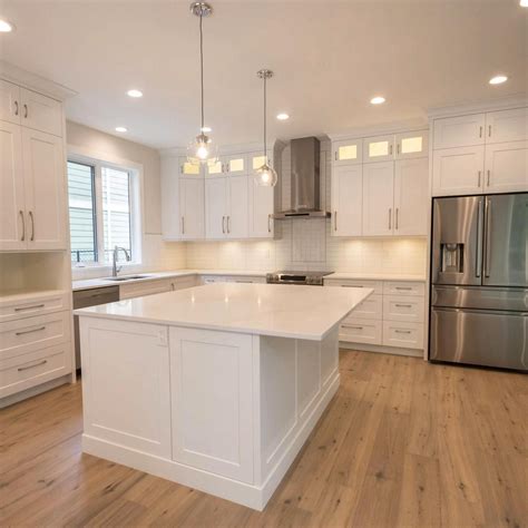 The White Shaker Cabinets Countertops And Backsplash The Stainless Steel Appliance White
