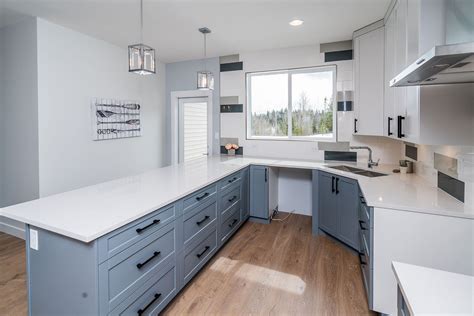 Cabinets are solid wood from paradise kitchen in prince george. Ground the look of your two-tone kitchen with painted base cabinets and white upper cabinets ...