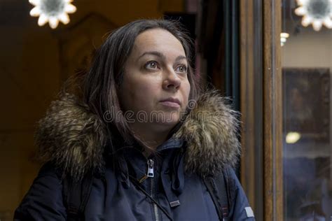 A 40 45 Year Old Woman Looks At A Street Showcase Dark Tone Stock