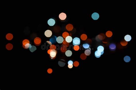 Abstract Blurry Small Light Glowing In The Dark Night Background Stock