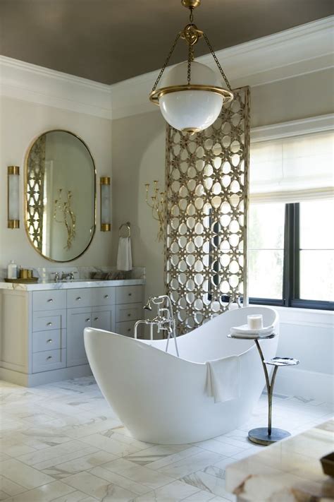 Modern white, gray and gold bathroom with a standalone tub ... Black gold marble bathroom set.