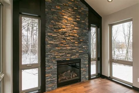 Decorating the fireplace with limestone veneer from toronto ecosol stone manufacturing can create a special atmosphere with a fireplace mantel made of decorative stone in toronto. floor to ceiling dry stacked stone ( ledger stone ...