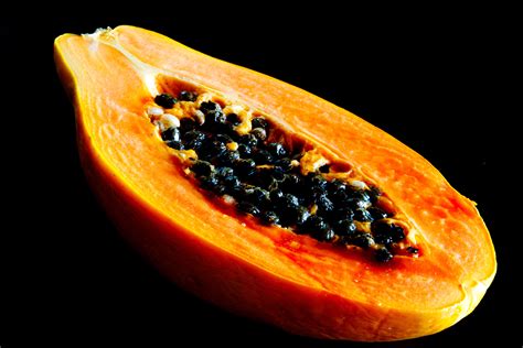 Slice Of Papaya With Black Background Hd Wallpaper Wallpaper Flare