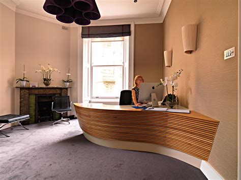 Bespoke Curved Reception Desk From Solid Oak And Corian Top Surface