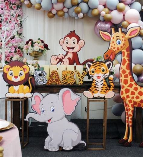 Stick to the jungle color scheme with greens, browns, and yellows. Safari-Themed Baby Shower Decor in 2020 | Safari baby ...