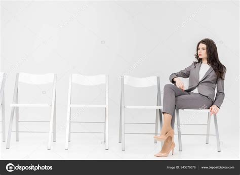Serious Woman Sitting Crossed Legs Chair Isolated Grey — Stock Photo