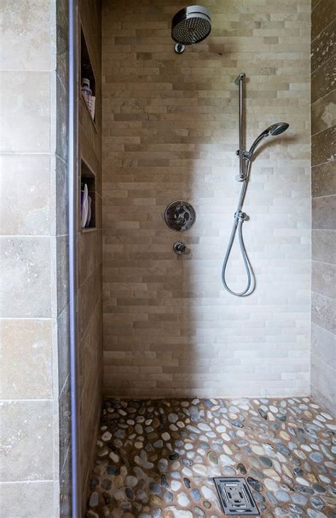 Natural Stone Walk In Shower With Pebble Tiled Floor Travertine Wall