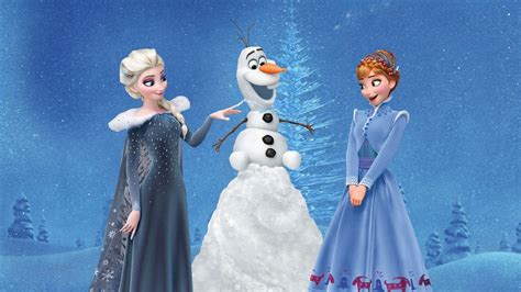 Two Frozen Princesses Standing Next To Each Other In Front Of A Snow