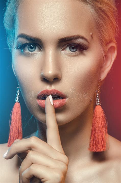 Secret Beautiful Girl With His Finger Near The Lips Stock Photo
