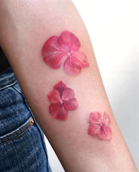 little pink flowers tattoo inkstylemag pink tattoo pink flower tattoos tattoos
