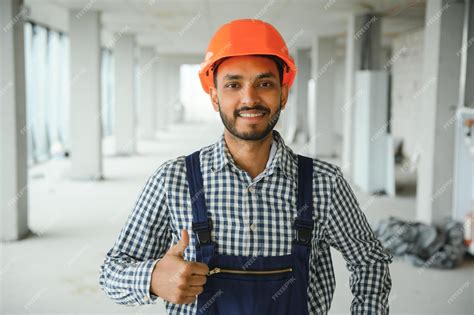 Premium Photo Indian Male Construction Worker Standing In Uniform And
