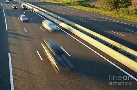 Speeding Cars On Highway At Sunset Photograph By Sami Sarkis Fine Art