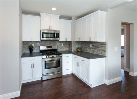 The countertop uses solid mahogany. Modern kitchen with warm wood floors, gray paint, white ...