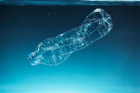 Premium Photo Single Use Plastic Bottle Floating In The Ocean