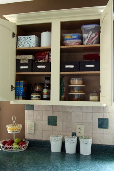 Tastefully designed, they feature a color scheme of browns, dark blues and tans, with faux wood accents and cabinets. IHeart Organizing: Kitchen Cabinet Basket Bliss | Home ...
