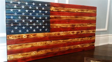 vintage american flag made out of wood and then scorched with flames rustic american flag
