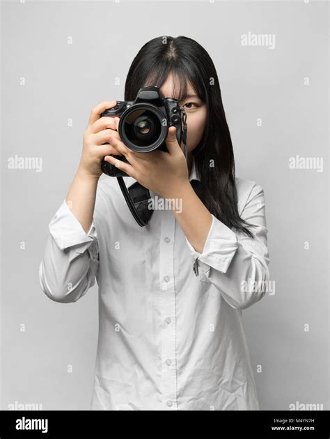 Asian Woman Holding Dslr Camera Stock Photo Alamy