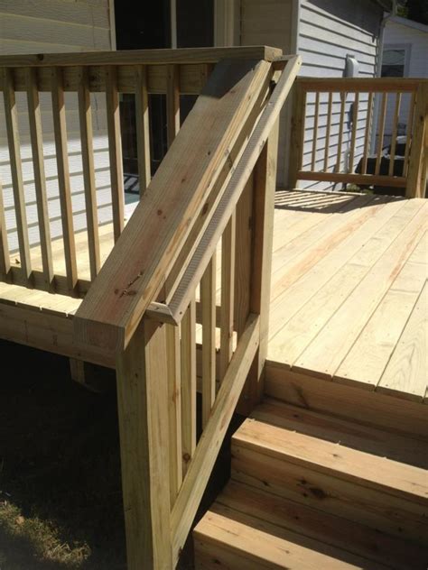 Stair rails on decks should be between 34 inches and 38 inches high measured vertically from the nose of the tread to the top of the rail. Strong stair railing with smooth finish - Qualis Construction