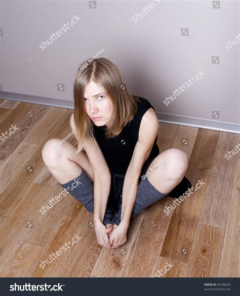 Scared Young Woman Sits On A Floor Stock Photo 50738203 Shutterstock