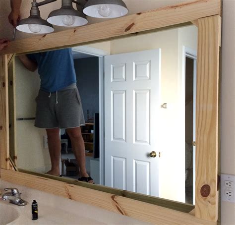 Framed mirrors are a fabulous finishing touch. DIY Rustic Wood Mirror Frame — Tag & Tibby