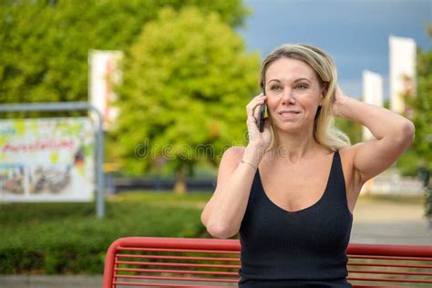 Natural Pose Of A Woman Chatting On Her Smartphone Stock Image Image Of Hair Woman 252502241