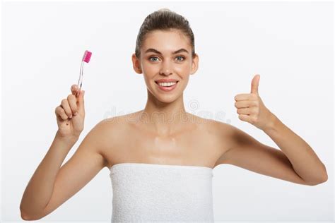 Beauty Portrait Of A Happy Beautiful Half Naked Woman Brushing Her Teeth With A Toothbrush And