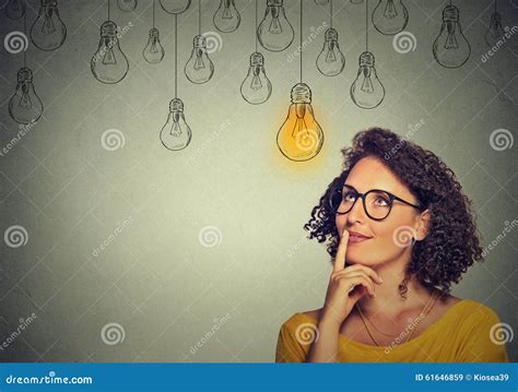 Thinking Woman In Glasses Looking Up With Light Idea Bulb Above Head