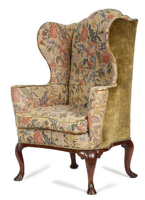 A George I Walnut Wing Armchair C1725 Later Upholstered With 18th