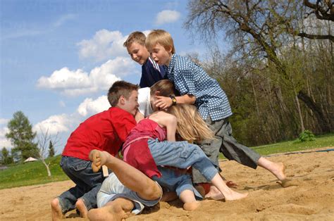 Children 6 9 Play Fighting On Playground Stock Photo