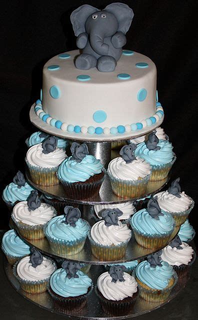 White bow and elephant cupcakes, 2 tier elephant fondant cake and raspberry/vanilla macarons. Elephant cake with matching cupcakes | Elephant cupcakes, Elephant baby shower boy, Baby shower ...