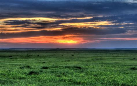 South Dakota Badlands National Park Sunset Over The Grassland 1