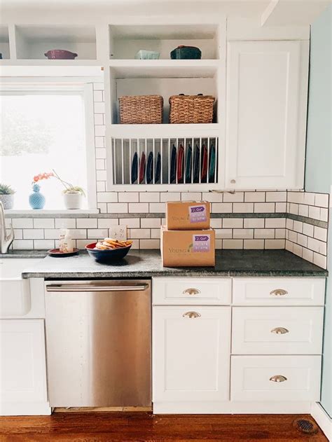 The high spot is usually the corner or one of the end base cabinets. 1920s Tudor. DIY kitchen renovation. Soapstone countertops ...