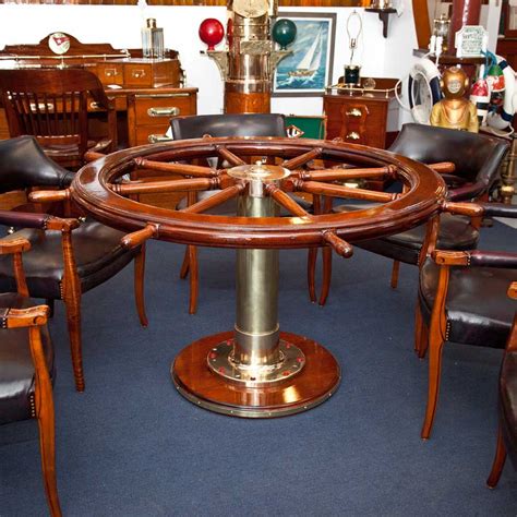 A collapsible dining table set also provides modern families with convenience in the form of intelligent use of space. Ship's Wheel Dining Table with Officer's Chairs