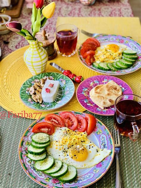 A Table Topped With Plates Filled With Different Types Of Food And