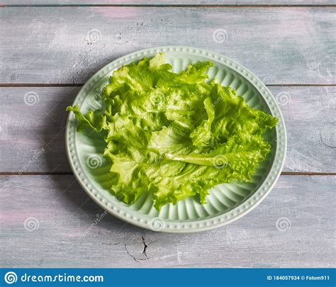 Leaf Lettuce On A Ceramic Light Green Plate For Preparing Food Laying
