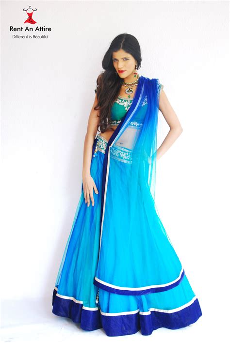 add a sense of elegance and glamour to any occasion with this blue net and satin lehenga choli
