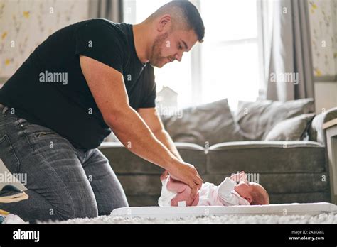 Father Changing Babys Diaper At Home Stock Photo Alamy